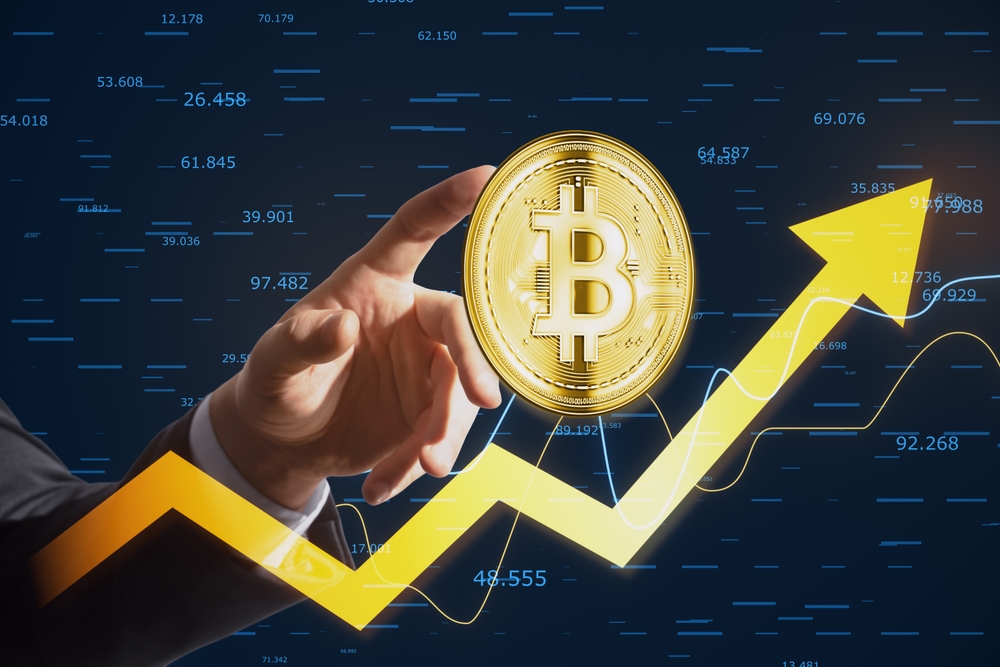 Close,Up,Of,Businessman,Hand,Pointing,At,Golden,Bitcoin,Arrow